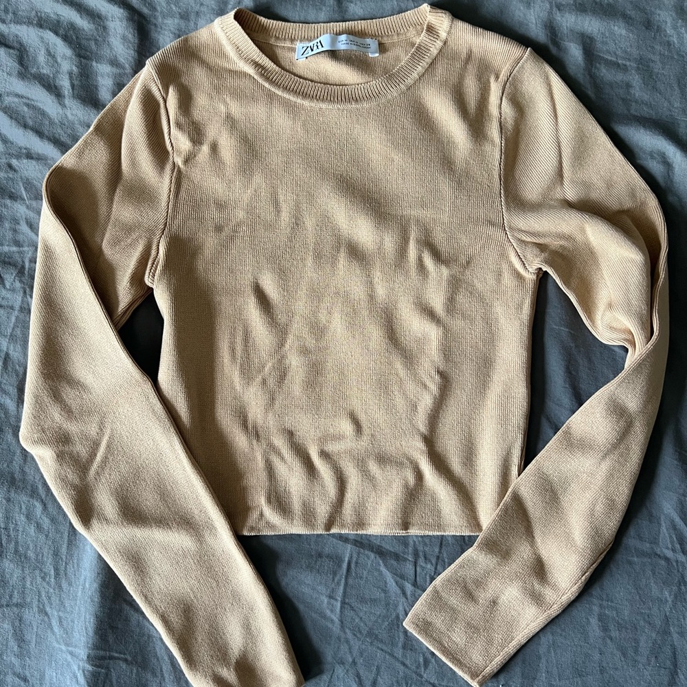 Crop top medium in size for fits very snug, thick material